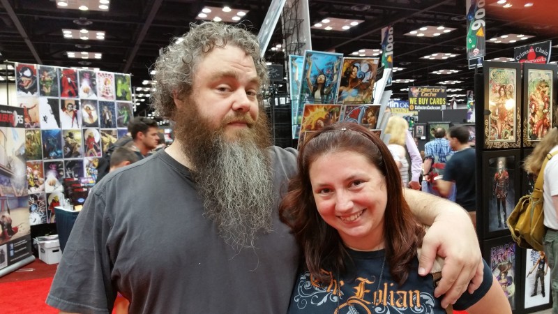 A photo of Patrick Rothfuss and I, taken in the dealers hall at Gen Con 2015.