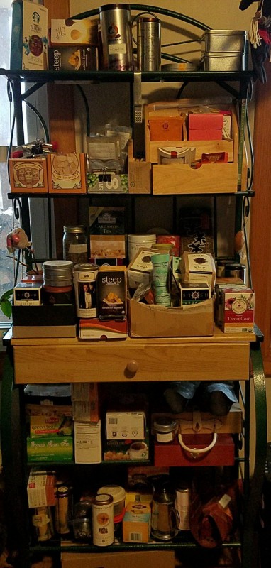 Photo of a shelf unit, full of different varieties of tea.