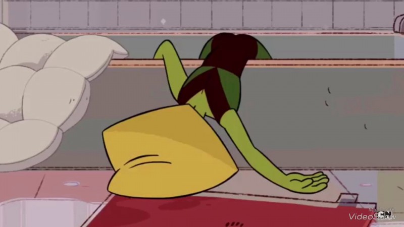Peridot from the show Steven Universe, flumped over the side of a bathtub in a depressed funk.