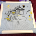 Photograph of a partially completed cross-stitch project, made from the pattern Evening in the Shire.
