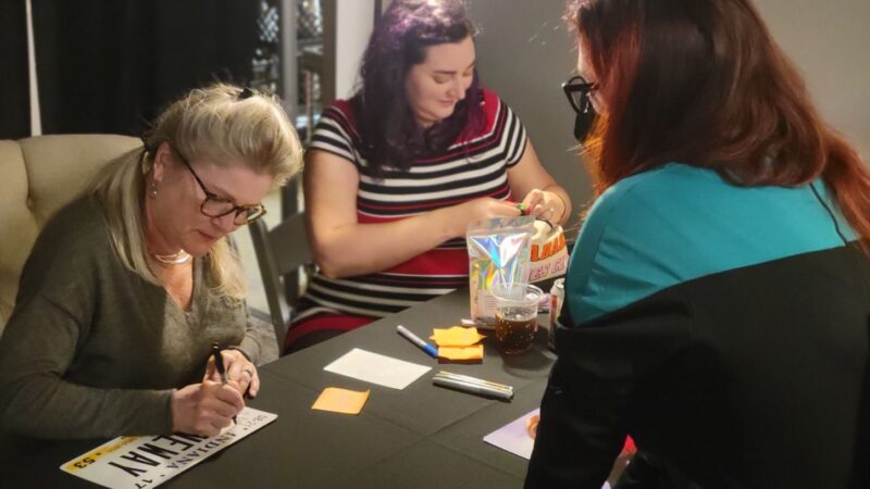 Kate Mulgrew signing my Janeway license plate.